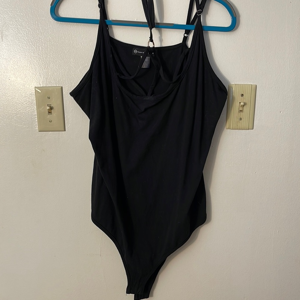 Lightly worn black body suit with chest detail straps